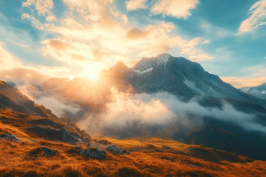 Bright rays of the sun rising over the mountain range. Mountain landscape in the morning fog. The concept of inspiration by the beauty of nature.