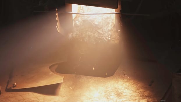 A man in a hard hat faces industrial challenges, walking through flames that symbolize overcoming obstacles, culminating in a well dressed man on stage, showcasing leadership and resilience. Stock Clip