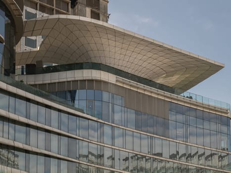 Bangkok, Thailand 23 Dec,2024 - Modern architecture building design with A steel frame glazed with many glass wall reflecting and sky in the background. use it as your Wallpaper, Poster and Space for text, Selective focus.