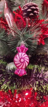 new year red toys for christmas tree, green branch holiday objects decoration decor decorations. High quality photo