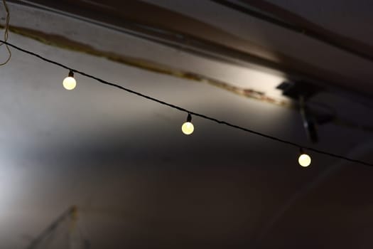 A beautiful and captivating arrangement of glowing string lights adds an inviting warmth to an intimate setting