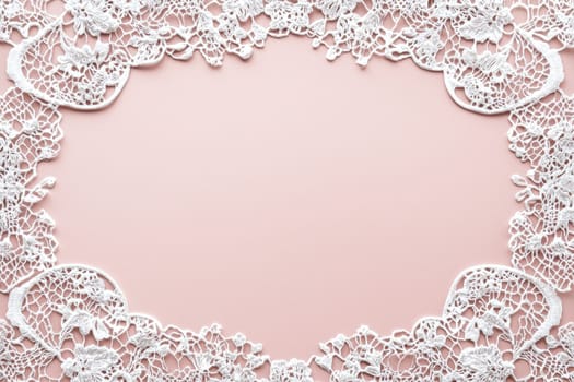 Elegant wedding greeting card featuring a white lace border on a soft pink background with subtle silver details. the design has a central blank area perfect for adding personalized messages, ideal for print, card, or poster designs.