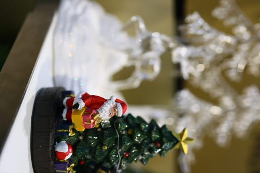 A charming Christmas decor showcasing Santa alongside a beautifully adorned and decorated tree filled with cheer