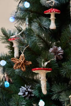 This enchanting Christmas tree is beautifully adorned with whimsical mushrooms and various natural decorations