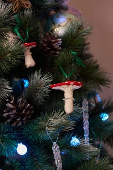 Colorful and vibrant mushroom ornaments beautifully highlight and enhance a wonderfully decorated Christmas tree