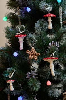 A beautifully festive Christmas tree that is adorned with charming mushroom ornaments and twinkling colorful lights
