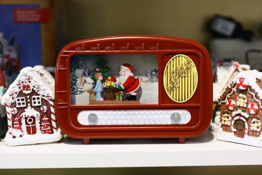 Charming vintage radio showcasing Santa and a snowman, perfect for holiday dcor