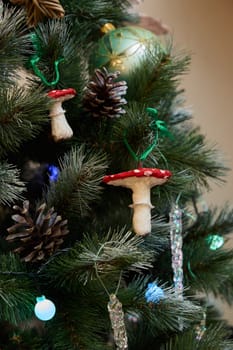 A beautifully decorated Christmas tree with charming mushroom ornaments and rustic pinecones, festive this season