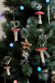 Unique and charming holiday decorations that prominently feature colorful mushroom ornaments on a festive tree