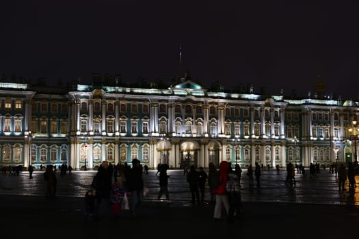The illuminated historic palace stands majestically at night, creating a vibrant atmosphere of excitement