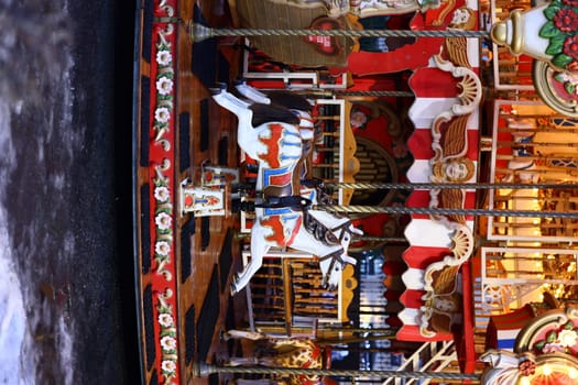 A beautifully crafted carousel horse amid vibrant decorations, capturing a nostalgic funfair atmosphere.