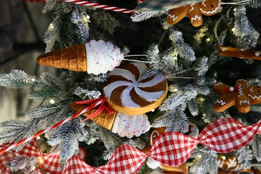 A delightful and vibrant array of colorful candythemed decorations beautifully adorns a stunning holiday tree