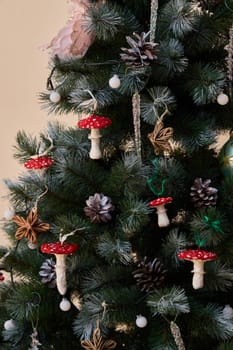 A festive Christmas tree adorned with colorful mushrooms, pinecones, and ornaments for a unique touch.