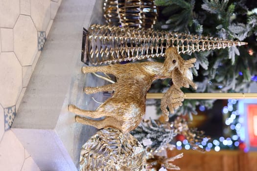 The stunning gold moose alongside the beautifully decorative tree significantly enhance the festive holiday ambiance