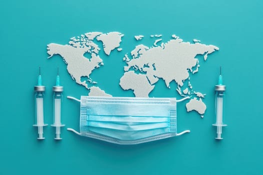 A blue background with a mask and syringes on it. The syringes are in different positions, some are on the left side of the mask