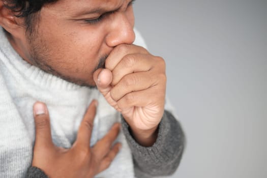 Sick man got flu allergy sneezing and blowing nose