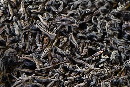 Loose black tea leaves are prepared and waiting for the process of brewing a rich cup of tea
