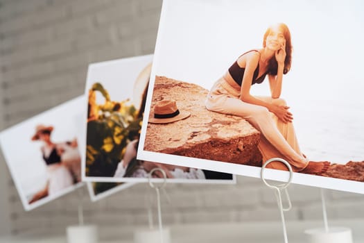 Printed colorful photos of women portraits. Printing photos hobby concept