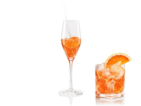 Aperol Spritz cocktail, vivid orange liquid, large ice cubes, orange slice, wine glass, dynamic fizz, Italian summer vibes..