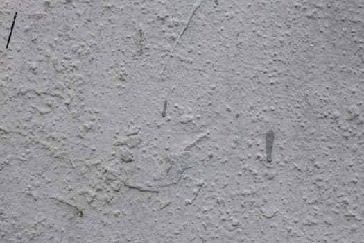 Surface of cement wall with uneven old plaster. Stone wall background.