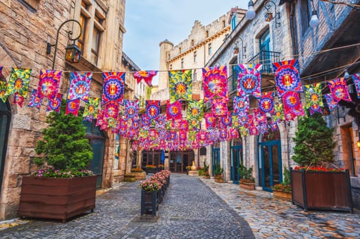 Decorated festive streets of the medieval stone city in French village in Ba Na Hills Park in Da Nang in Vietnam