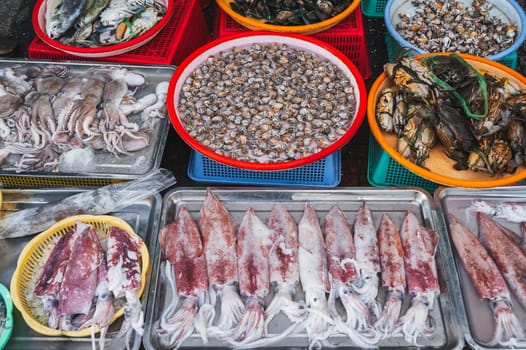 Seafood, including shrimp, octopuses, clams, sea snails, squid, octopus and mussels, are sold at the Asian street fish market.