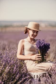A woman is sitting in a field of lavender flowers and wearing a straw hat. She is smiling and holding a bouquet of flowers. Scene is peaceful and serene, as the woman is surrounded by the beauty of nature.