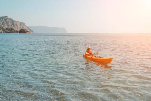 Kayak sea woman. Happy attractive woman with long hair in red swimsuit, swimming on kayak. Summer holiday vacation and travel concept