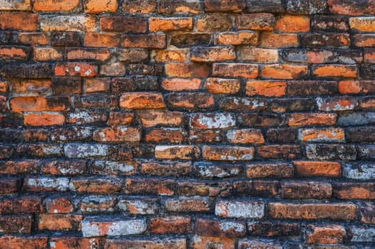 Ancient old orange brick brick wall close-up