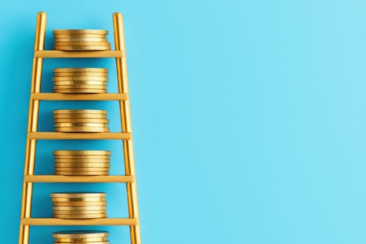 A creative representation of financial growth featuring a ladder with stacked coins on bright blue. Ideal for concepts related to wealth, investment, and success.