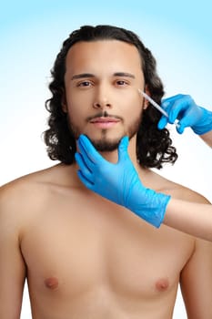 Man receiving cosmetic treatment with a syringe, showcasing a beauty procedure in a clinical setting