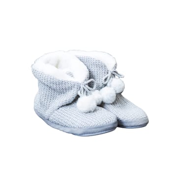 A lovely pair of gray slippers adorned with fluffy white pom poms sitting elegantly on a pristine white background