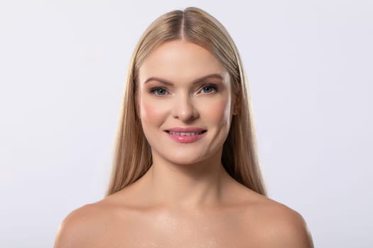 A stunningly beautiful woman displays a natural makeup style and showcases her radiant, glowing skin beautifully