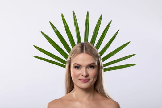 A stunning model showcases vibrant aloe vera leaves, blending beauty and nature in a creative photoshoot