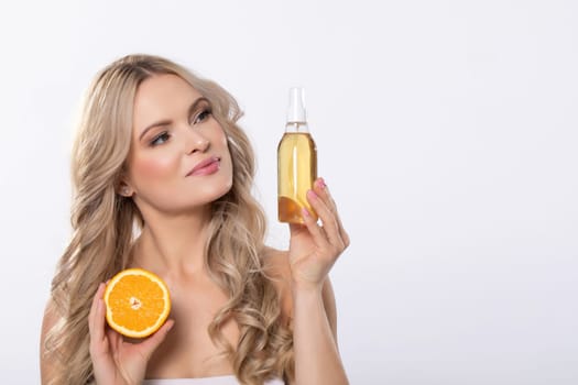 An impressive model showcasing refreshing citrusbased skincare designed specifically for enhancing glow and hydration