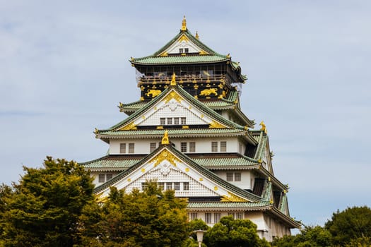 OSAKA, JAPAN - SEPTEMBER 25 2024: The iconic Osaka Castle and lush surrounds on a warm clear autumn day in Osaka, Japan on September 25th 2024