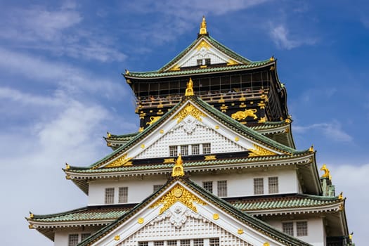 OSAKA, JAPAN - SEPTEMBER 25 2024: The iconic Osaka Castle and lush surrounds on a warm clear autumn day in Osaka, Japan on September 25th 2024