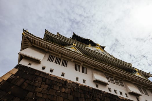 OSAKA, JAPAN - SEPTEMBER 25 2024: The iconic Osaka Castle and lush surrounds on a warm clear autumn day in Osaka, Japan on September 25th 2024