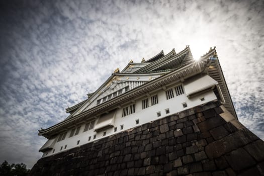 OSAKA, JAPAN - SEPTEMBER 25 2024: The iconic Osaka Castle and lush surrounds on a warm clear autumn day in Osaka, Japan on September 25th 2024