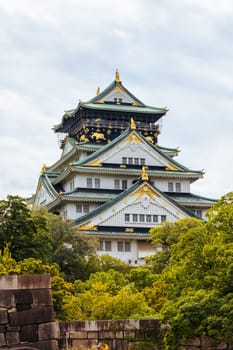 OSAKA, JAPAN - SEPTEMBER 25 2024: The iconic Osaka Castle and lush surrounds on a warm clear autumn day in Osaka, Japan on September 25th 2024