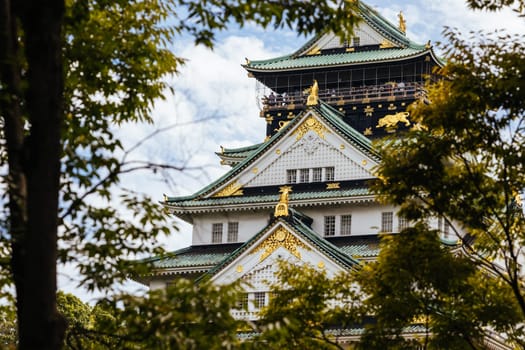OSAKA, JAPAN - SEPTEMBER 25 2024: The iconic Osaka Castle and lush surrounds on a warm clear autumn day in Osaka, Japan on September 25th 2024
