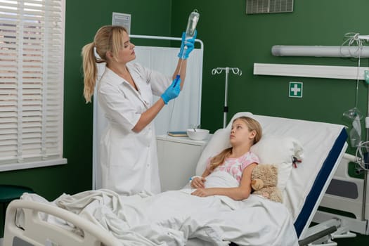A dedicated nurse is providing attentive care to a young patient in a hospital, ensuring their comfort and support