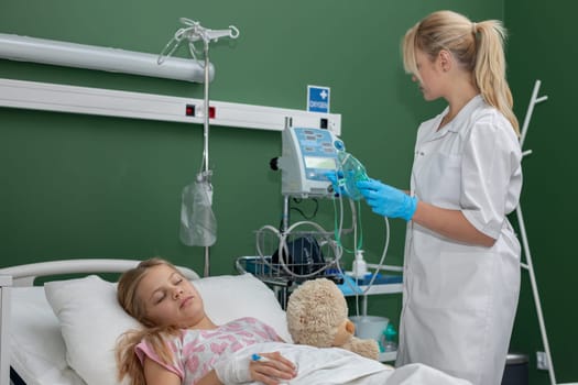 A dedicated nurse cares for a young patient recovering in a hospital filled with vital equipment and compassion