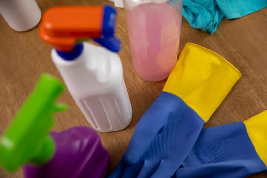 A variety of colorful cleaning tools and bottles are organized and ready for thorough home sanitation and organization