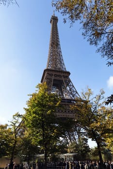 A bustling queue of tourists waiting to enter the Eiffel Tower in Paris, France - October 24, 2024