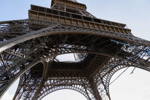 A captivating lowangle shot that beautifully captures the intricate structure and design of the Eiffel Tower