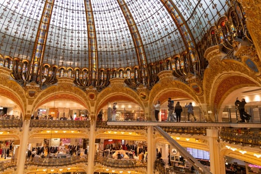 Explore the grandeur of Galeries Lafayette, a famous shopping destination in Paris, showcasing beautiful architecture. Paaris, France - October 24, 2024
