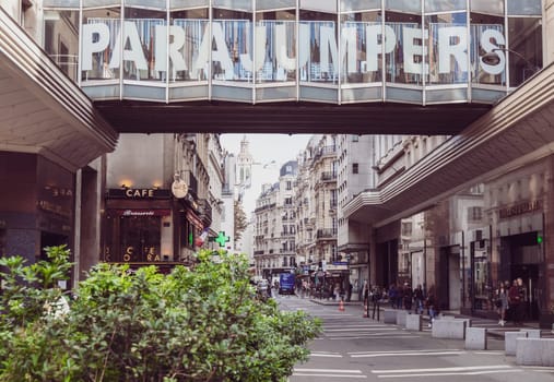 A picturesque view capturing a bustling shopping street that prominently features a Parajumpers storefront. Paris, France - October 24, 2024