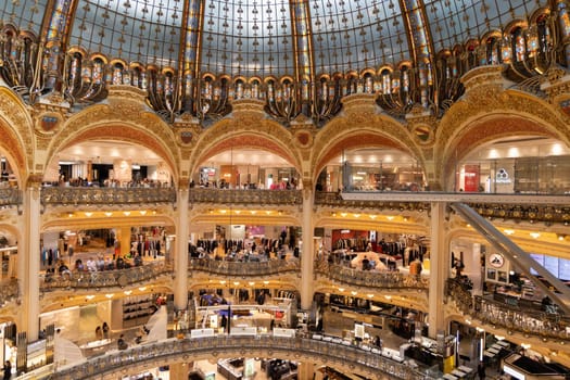 Explore the grandeur of Galeries Lafayette, a famous shopping destination in Paris, showcasing beautiful architecture. Paaris, France - October 24, 2024