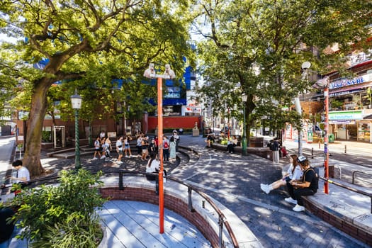 OSAKA, JAPAN - SEPTEMBER 26 2024: The trendy and fashionable Amerikamura district on a clear autumn day in Osaka, Japan